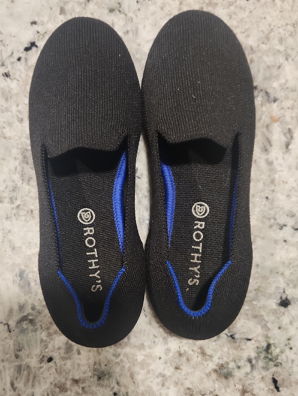 Rothy's Black Knit Slip-Ons with Blue Interior Trim (Kids)